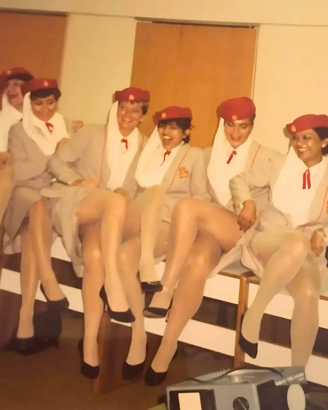 Vintage photo of Emirates cabin crew women in uniform, 1980s airline travel lifestyle, travel blog founder origin story
