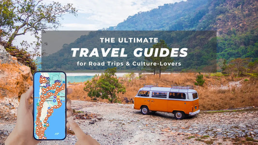 Digital travel guide on phone screen with Google Maps open and road trip stops in Argentina marked, next to vintage camper van in remote nature setting