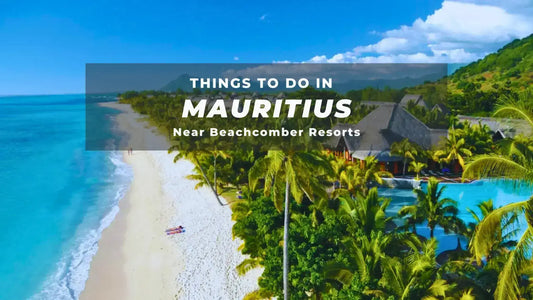 Scenic view of Mauritius beach near Beachcomber Resorts with lush greenery and turquoise ocean waters.